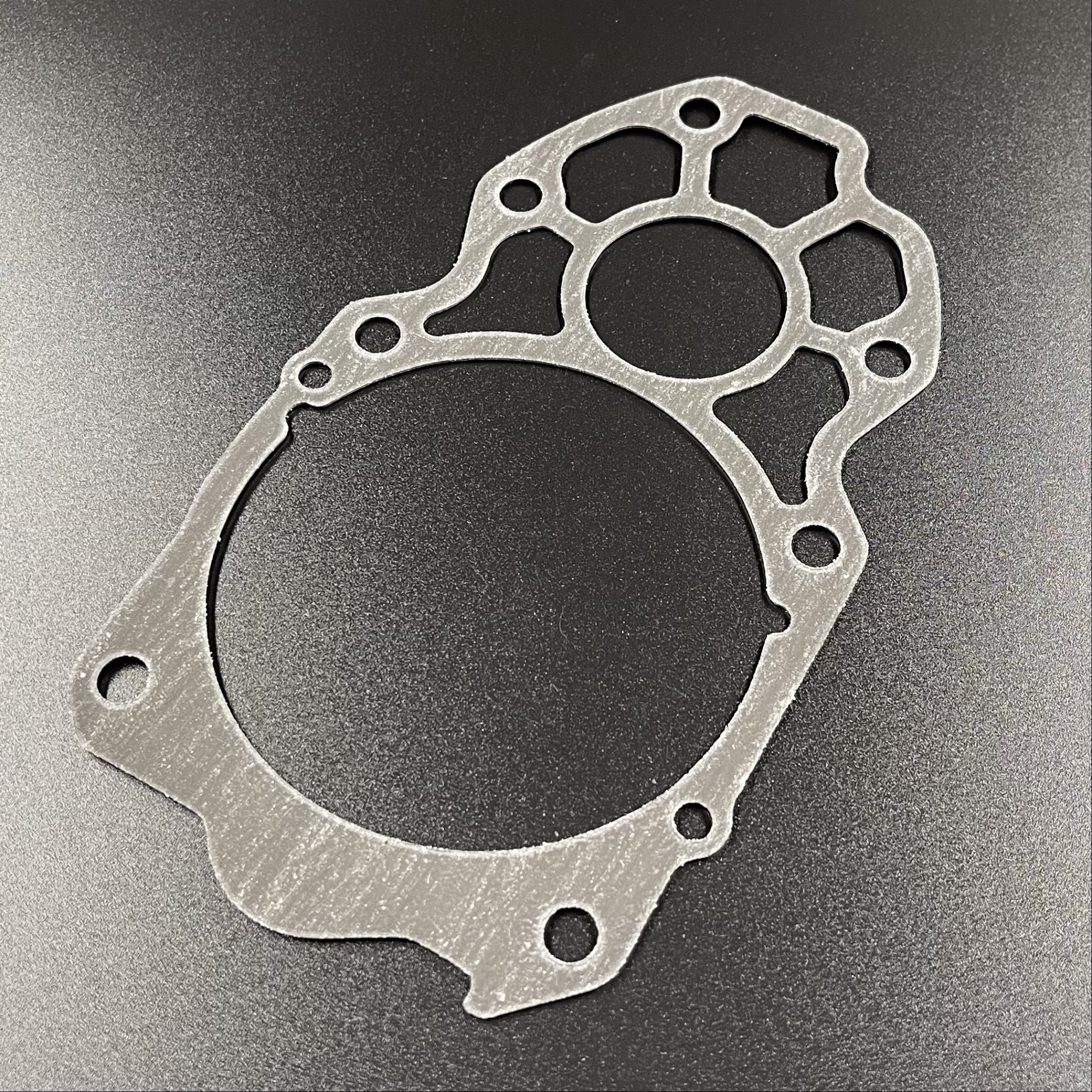 картинка Прокладка под пластину помпы охлаждения Yamaha F225-350 (Omax)